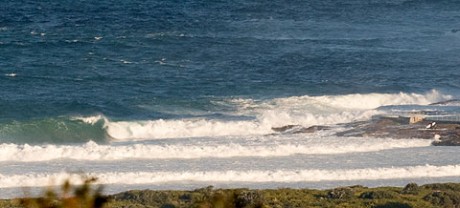 1630: a solitary figure contemplates rocking off into the madness of 4m south swell and SE wind.